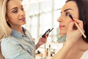 Beautiful girl doing makeup